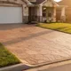 Decorative stamped concrete patio in Magnolia, TX with warm earth-tone stain