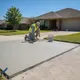 Contractor repairing a cracked concrete driveway in Magnolia, TX