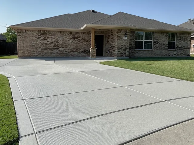 Newly poured concrete driveway in Magnolia, TX finished with a smooth broom texture